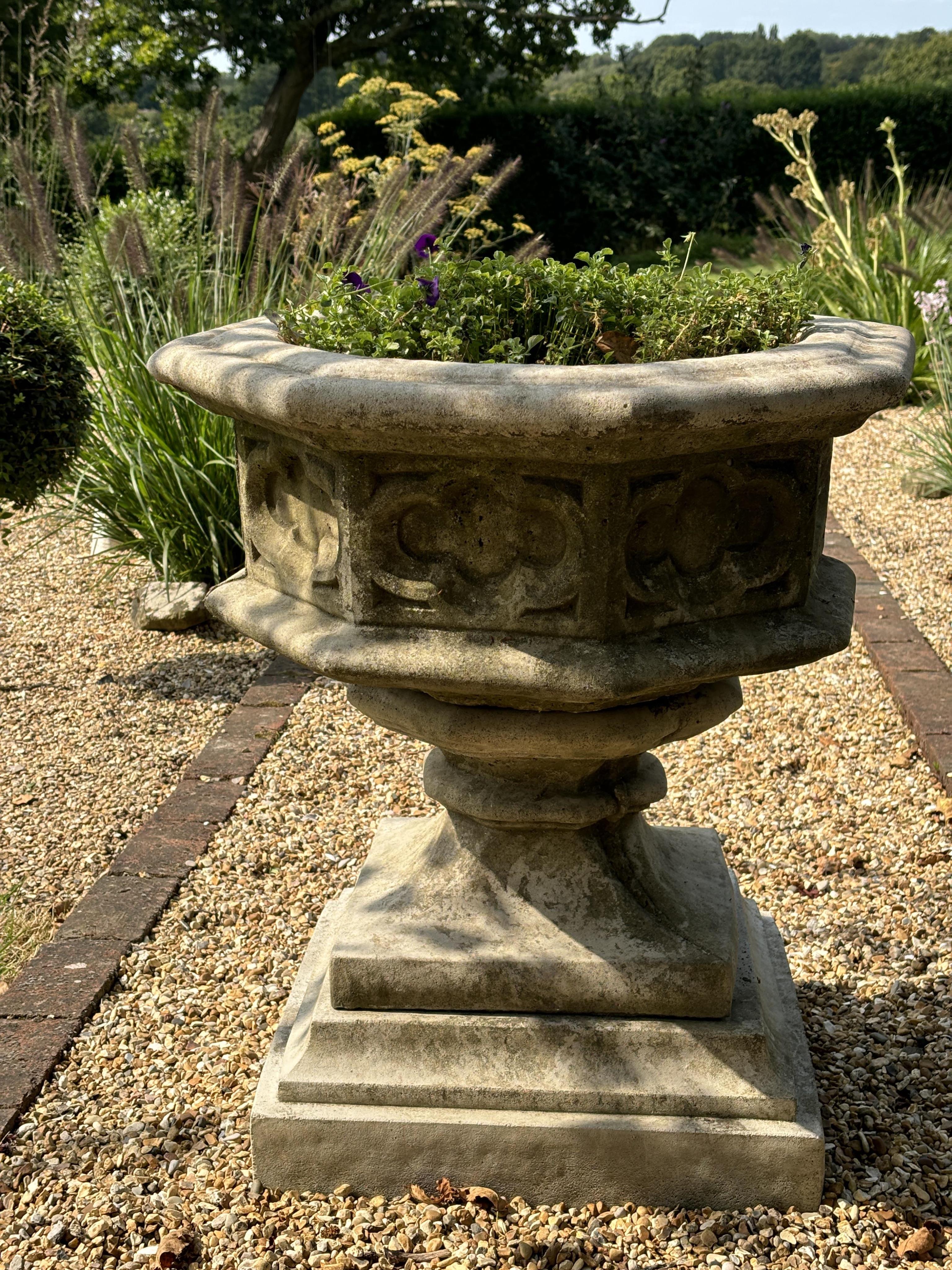 A reconstituted stone font planter, height 72cm, width 62cm. planting removed. Condition - weathered, otherwise good